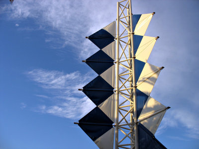 Blue and white sails trapped on land