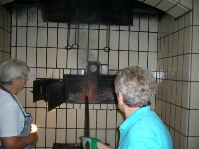 Removing the Coals from the oven