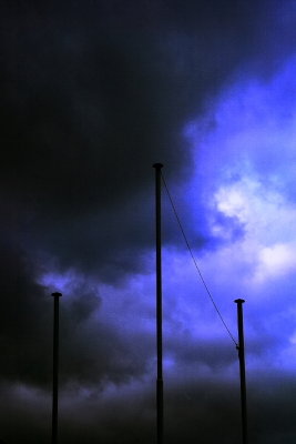 Three poles in the stormy sky