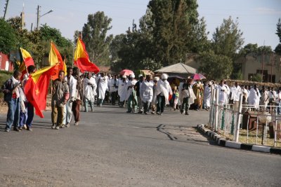 Funeral procession through Axum.  Note red and yellow Tigray flags being carried.
