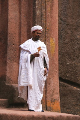 A priest at the entrance to Bet Giorgis