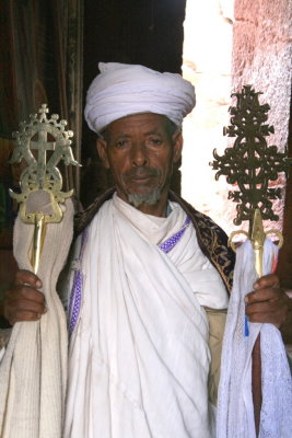 A priest shows us the crosses at Bet Gebriel-Rafael