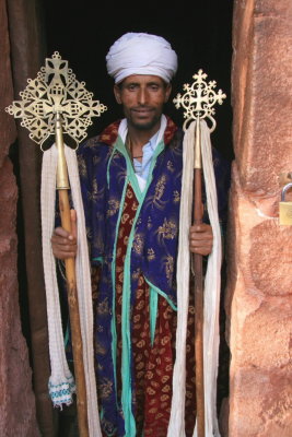 Another priest shows us the traditional crosses under his care