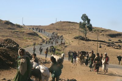 A road near Lalibela being traversed by people carrying items to market