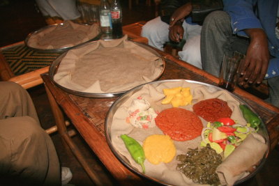 Tradtional Ethiopian food laid out on injera bread