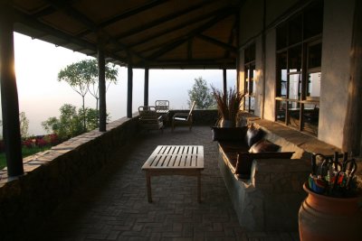 The comfortable patio of the main lodge is the perfect place to watch the sun set over the Virungas.