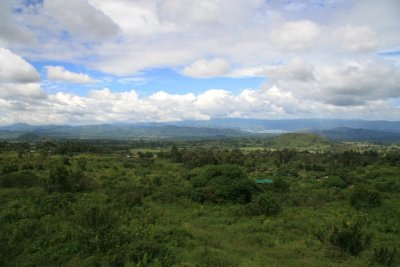 A panoramic view northward from the observation platform, a few minutes' hike from the visitor center.  From here, you can see the town of Bunagana, Lake Mutanda and, in the distance, the Bwindi Impenetrable Forest.