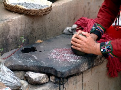 Making dye for fabric in Chinchero