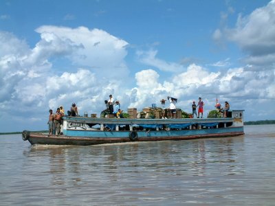 Riverboat loaded with people and cargo
