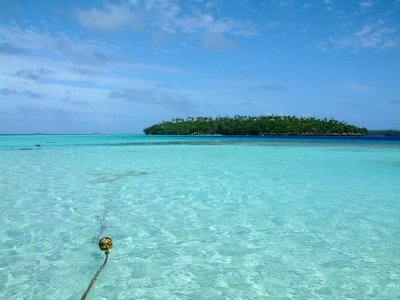 Mounu Island is surrounded by shallow, clear water, with Ovalu Island a few hundred yards away