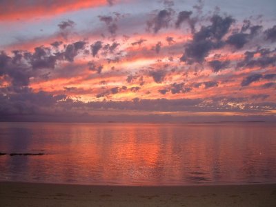 A spectacular multicolored sunset develops over Fafa Island