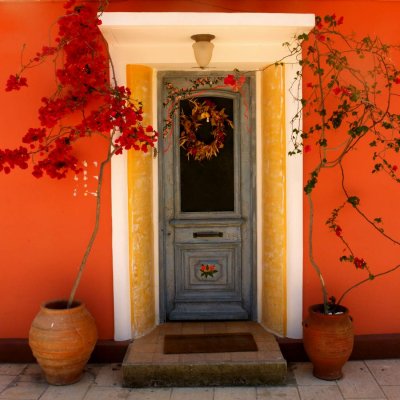 Door with orange wall