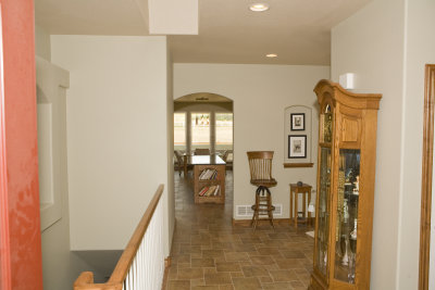 Entry way looking into kitchen and dining; stairwell to studio on left.