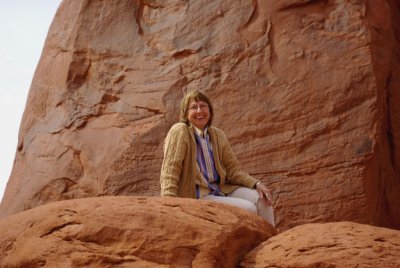 Katie on rock, Monument Valley