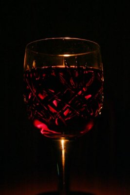 candle lit glass of wine *