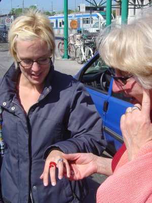 Barb admiring Kristin's ring