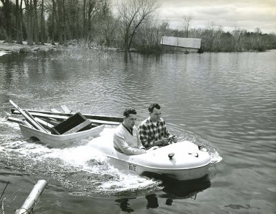 Penguin with trailer on lake