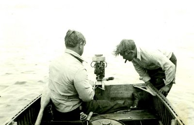 George & Bob McDonald repairing boat motor