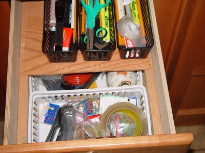 DESK JUNK DRAWER WITH SLIDING TOP PANEL FOR EASY ACCESS TO THE BOTTOM OF THE DRAWER