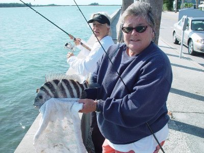 PROUD FISHERPERSON AT THE PIER AT ST PETERSBURG