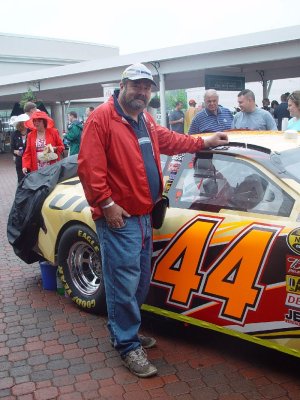 DON ADMIRED ONE OF THE RACE CARS IN THE STANDS