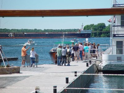 THE PEOPLE LINED UP ON THE DOCK FOR HOURS FOR A CHANCE TO RIDE ON THE LAUNCH