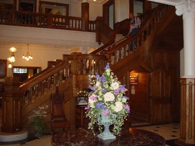 THE WOODEN STAIR CASE IN THE MAIN ENTRANCE