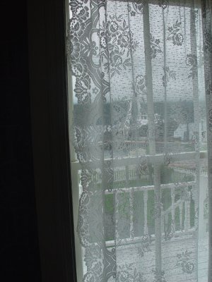 THERE ARE LACY WINDOW CURTAINS IN MOST HOUSES OF NEWFOUNDLAND EVEN TODAY