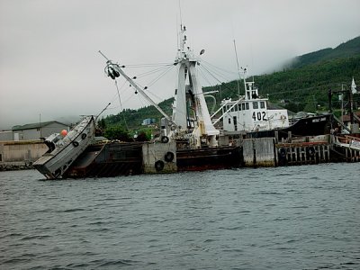 THIS IS ONE OF THE FISHING BOATS WE SAW AT WOODY POINT-NOTICE THE SECOND BOAT USED TO SET THE NETS