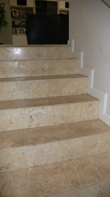 Floors, stairs & fireplace facing is Coquina tile (crushed coral and shells)