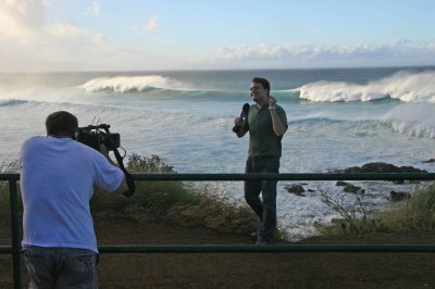 Weather Channel reporter/camera man doing story on high winds and surf