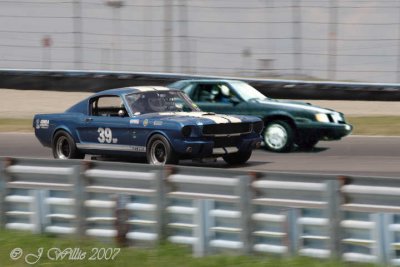 In a bold move, Brian overtakes a Shelby Mustang on the outside of this turn in his '84 SVO Mustang.