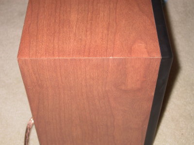 Tiny ding on the top edge of this cabinet (accidentally dinged by me in my LR)
