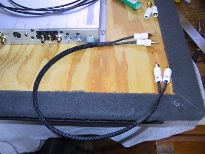 Pull the 1/2 heat shrink onto the sleeving, get the sleeving and wires positioned properly.  Shrink one end of the sleeving.