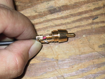 Insert the cable to get red inside the center conductor, ground to the outside of the RCA