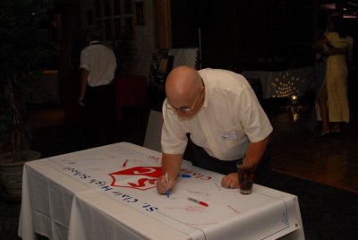 Dick signing the Banner