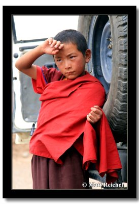 Novice Monk Leaning Against Our Jeep, Central Tibet