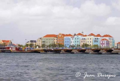 An array of  pastel buildings  on the waterfront in Willemstad
