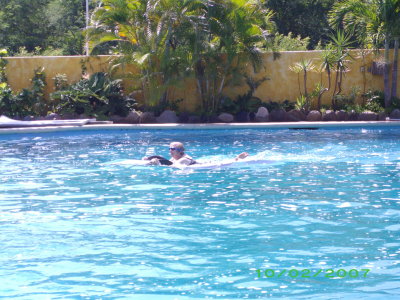 MamaJean rides a dolphin in Puerto Vallarta, Mexico