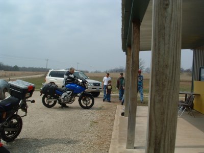 Locals arrive, Warren preparing his escape. Just in case.