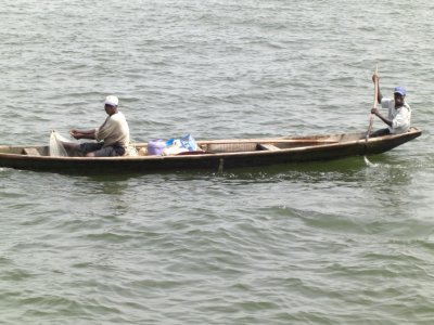 Fisherman O/B Canoo Boat fishing in the river