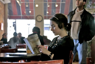 Girl Reading in a Cafe