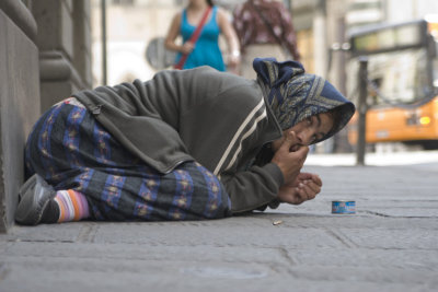 Begger woman in Florence, Italy