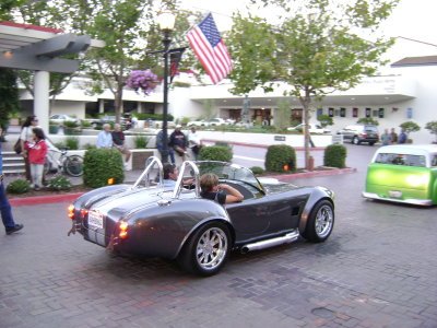 Shelby Cobra underneath Old Glory at Portola Plaza