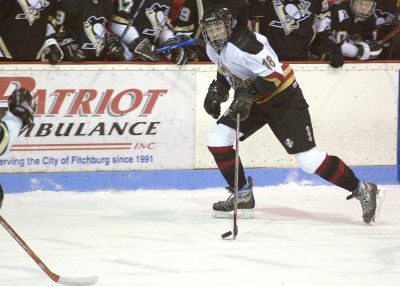 Nehring carries past Penguin bench.jpg
