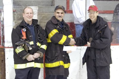 Huskies Donate to Fitchburg Firefighters 4x6.jpg