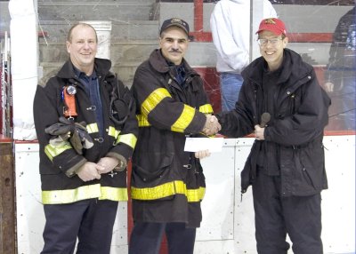 Huskies Donate to Fitchburg Firefighters 5X7.jpg