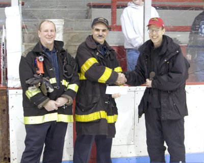 Huskies Donate to Fitchburg Firefighters 8x10.jpg