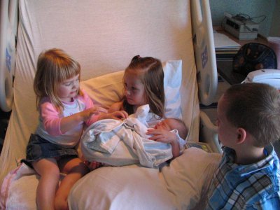 Sophie giving Laney advise on how to hold her brother