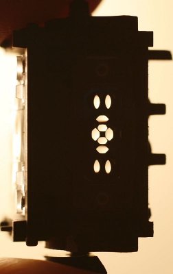 View throught the prism box showing the openings which allow light to hit the AF sensor.